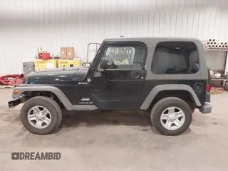 2006 Jeep Wrangler Sport Right Hand Drive with VIN 1J4F449S56P741328, listed as a IAAI auction lot 41476847 with 67,203 mi miles. Bid and sale history available at carsss.com. Image 14.