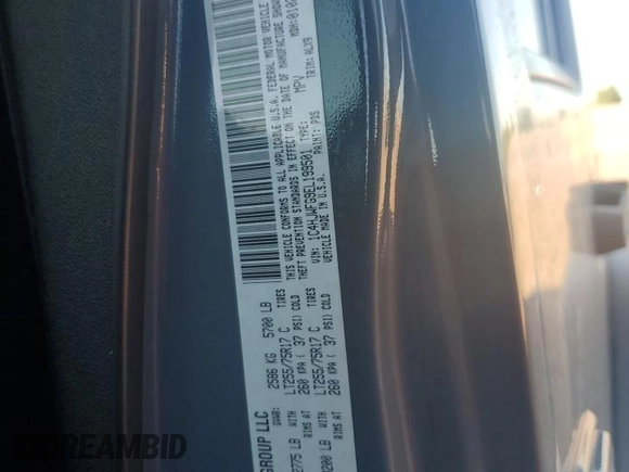 2014 Jeep Wrangler Unlimited Rubicon with VIN 1C4HJWFG9EL199501, listed as a Copart auction lot 61443595 with 86,940 mi miles and Salvage title. Bid and sale history available at DreamBid. Image 12.