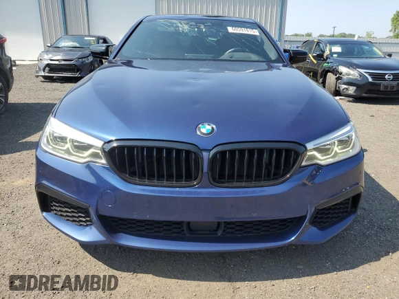 2020 BMW 5 Series M550i xDrive with VIN WBAJS7C0XLBN96338, listed as a Copart auction lot 60591815 with 73,910 mi miles and Salvage title. Bid and sale history available at DreamBid. Image 5.