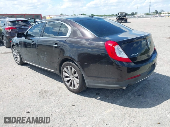 2014 Lincoln MKS with VIN 1LNHL9EK0EG608300, listed as a IAAI auction lot 41900902 with 144,253 mi miles. Bid and sale history available at carsss.com. Image 3.