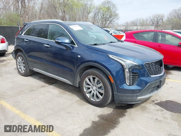 2021 Cadillac XT4 AWD Premium Luxury z VIN 1GYFZDR45MF048569, wystawiony jako IAAI lot #41902941 z przebiegiem 53 891 mil mil oraz . Historia ofert i sprzedaży dostępna na DreamBid. Obrazek 1.