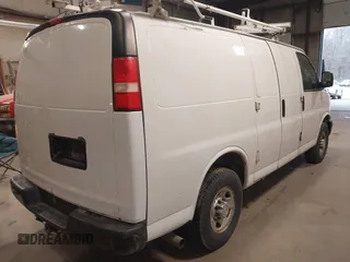 2015 Chevrolet Express Cargo Van with VIN 1GCWGFCF9F1167677, listed as a IAAI auction lot 42018087 with 148,263 mi miles. Bid and sale history available at carsss.com. Image 4.