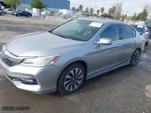 2017 Honda Accord Hybrid Touring with VIN JHMCR6F7XHC006357, listed as a IAAI auction lot 41263478 with 118,758 mi miles. Bid and sale history available at carsss.com. Image 2.