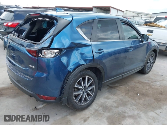 2018 Mazda CX-5 Touring z VIN JM3KFACM5J1442416, wystawiony jako IAAI lot #42093137 z przebiegiem 65 102 mil mil oraz . Historia ofert i sprzedaży dostępna na DreamBid. Obrazek 4.