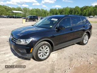 2018 Volkswagen Tiguan S with VIN 3VV0B7AXXJM122461, listed as a Copart auction lot 56054285 with 77,176 mi miles and Salvage title. Bid and sale history available at DreamBid. Image 1.