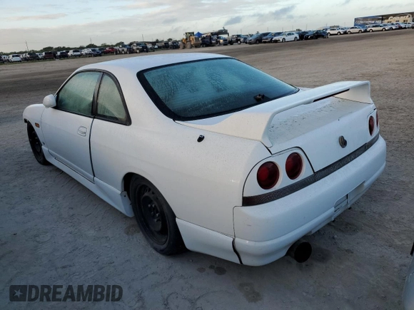 1995 Nissan Skyline z VIN ECR33060119, wystawiony jako Copart lot #76521404 z przebiegiem 134 480 mil mil oraz Szkoda całkowita • Salvage title. Historia ofert i sprzedaży dostępna na DreamBid. Obrazek 2.