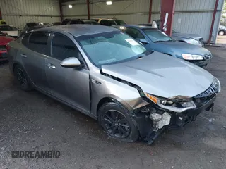 2016 Kia Optima LX z VIN 5XXGT4L33GG101416, wystawiony jako IAAI lot #42189099 z przebiegiem 132 985 mil mil oraz . Historia ofert i sprzedaży dostępna na DreamBid. Obrazek 1.