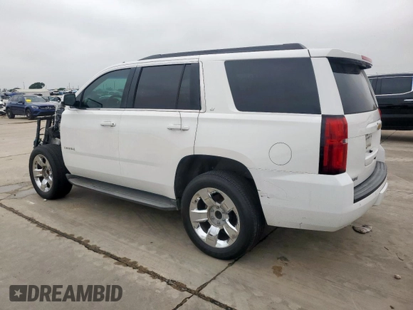 2015 Chevrolet Tahoe LT with VIN 1GNSCBKC0FR210211, listed as a Copart auction lot 55496995 with 128,296 mi miles and Salvage title. Bid and sale history available at DreamBid. Image 2.