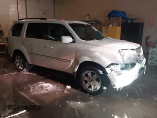 2011 Honda Pilot Touring z VIN 5FNYF4H96BB055438, wystawiony jako IAAI lot #41541093 z przebiegiem 161 919 mil mil oraz . Historia ofert i sprzedaży dostępna na DreamBid. Obrazek 1.
