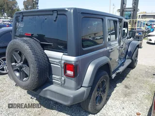 2021 Jeep Wrangler Unlimited Sport Altitude with VIN 1C4HJXDGXMW662493, listed as a IAAI auction lot 41288957 with 64,808 mi miles and . Bid and sale history available at DreamBid. Image 4.