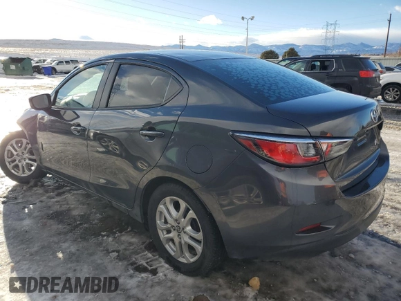 2016 Scion iA with VIN 3MYDLBZV1GY103531, listed as a Copart auction lot 42111955 with 104,882 mi miles and Salvage Title. Bid and sale history available at carsss.com. Image 2.