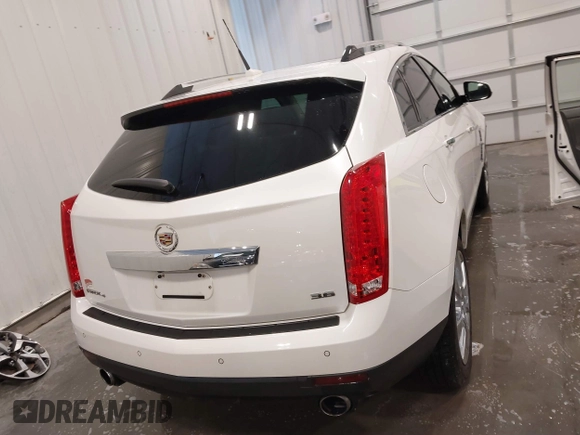 2012 Cadillac SRX Premium Collection z VIN 3GYFNFE38CS591123, wystawiony jako IAAI lot #41827636 z przebiegiem 143 867 mil mil oraz . Historia ofert i sprzedaży dostępna na DreamBid. Obrazek 17.