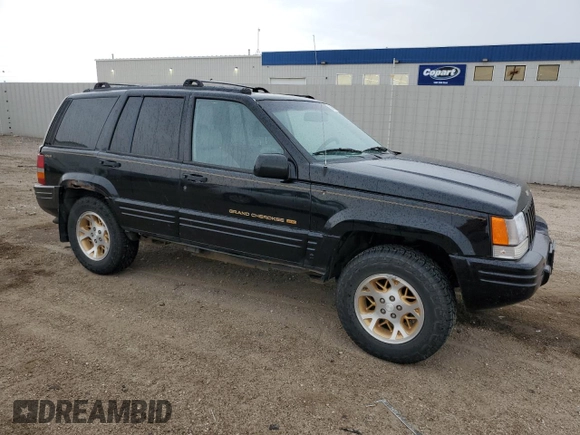 1997 Jeep Grand Cherokee Limited z VIN 1J4GZ78Y8VC586034, wystawiony jako Copart lot #58061705 z przebiegiem 244 355 mil mil oraz Czysty tytuł • Clean title. Historia ofert i sprzedaży dostępna na DreamBid. Obrazek 4.