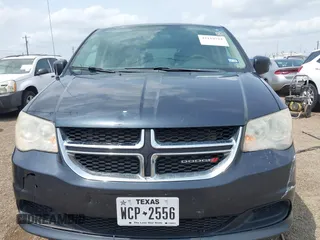 2013 Dodge Grand Caravan SXT with VIN 2C4RDGCGXDR749803, listed as a IAAI auction lot 42118722 with 264,454 mi miles and . Bid and sale history available at DreamBid. Image 12.