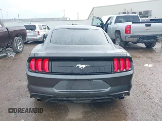 2018 Ford Mustang EcoBoost z VIN 1FA6P8TH2J5184485, wystawiony jako IAAI lot #41884810 z przebiegiem 74 999 mil mil oraz . Historia ofert i sprzedaży dostępna na DreamBid. Obrazek 16.