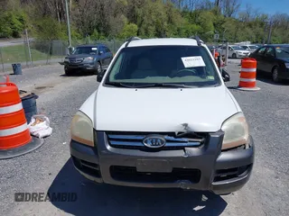 2006 Kia Sportage LX with VIN KNDJF723567151614, listed as a IAAI auction lot 42022102 with 128,564 mi miles and . Bid and sale history available at carsss.com. Image 12.