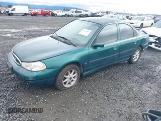 1999 Ford Contour SE Fleet with VIN 1FAFP66L3XK227522, listed as a IAAI auction lot 41702873 with 140,926 mi miles. Bid and sale history available at carsss.com. Image 2.