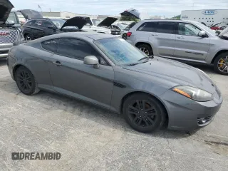 2007 Hyundai Tiburon GS z VIN KMHHM66D47U243846, wystawiony jako Copart lot #57509725 z przebiegiem 181 941 mil mil oraz Szkoda całkowita • Salvage title. Historia ofert i sprzedaży dostępna na DreamBid. Obrazek 4.
