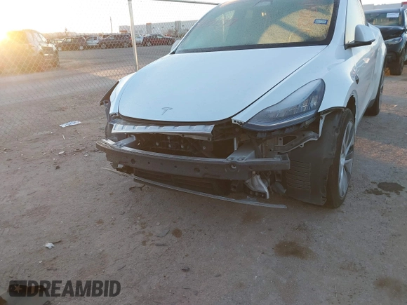 2023 Tesla Model Y Long Range z VIN 7SAYGDEE6PA061228, wystawiony jako IAAI lot #41371547 z przebiegiem 25 121 mil mil oraz . Historia ofert i sprzedaży dostępna na DreamBid. Obrazek 6.