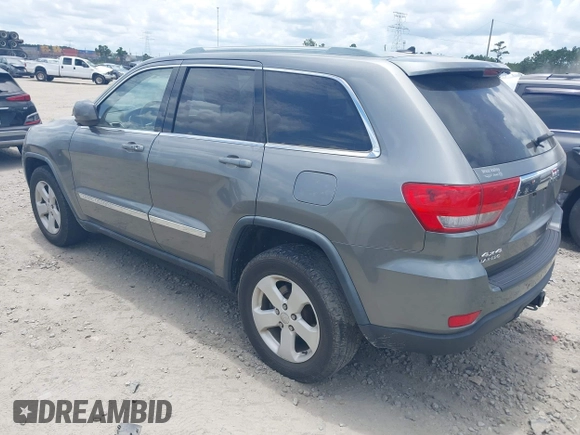 2011 Jeep Grand Cherokee Laredo with VIN 1J4RR4GG3BC595896, listed as a IAAI auction lot 42632333 with 135,426 mi miles and . Bid and sale history available at DreamBid. Image 3.