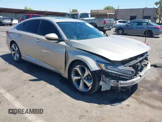 2018 Honda Accord Touring with VIN 1HGCV1F92JA014490, listed as a IAAI auction lot 42742872 with 100,742 mi miles and . Bid and sale history available at DreamBid. Image 1.