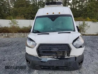 2020 Ford Transit Cargo with VIN 1FTBF4XG3LKB70573, listed as a Copart auction lot 77039474 with 131,873 mi miles and Salvage Title. Bid and sale history available at DreamBid. Image 5.