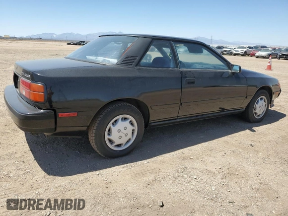 1989 Toyota Celica z VIN JT2ST67C8K7337876, wystawiony jako Copart lot #57918785 z przebiegiem 16 862 mil mil oraz Tytuł czysty. Historia ofert i sprzedaży dostępna na DreamBid. Obrazek 3.