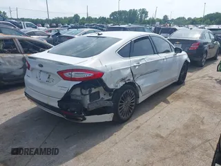 2016 Ford Fusion Titanium with VIN 3FA6P0K99GR317034, listed as a IAAI auction lot 42590288 with 200,468 mi miles and . Bid and sale history available at DreamBid. Image 4.