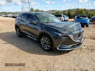 2017 Mazda CX-9 Grand Touring z VIN JM3TCADY8H0138866, wystawiony jako Copart lot #80894184 z przebiegiem Nie podano mil oraz Szkoda całkowita • Salvage title. Historia ofert i sprzedaży dostępna na DreamBid. Obrazek 12.