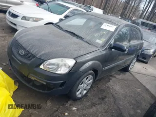 2009 Kia Rio LX with VIN KNADE243296481394, listed as a IAAI auction lot 41498863 with 59,222 mi miles. Bid and sale history available at carsss.com. Image 2.