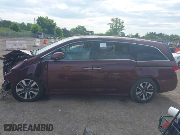 2014 Honda Odyssey Touring with VIN 5FNRL5H90EB120999, listed as a IAAI auction lot 42541370 with 96,454 mi miles and . Bid and sale history available at DreamBid. Image 15.