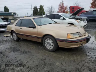 1987 Ford Thunderbird with VIN 1FABP64W7HH137025, listed as a Copart auction lot 80162264 with 137,140 mi miles and Salvage Title. Bid and sale history available at DreamBid. Image 4.