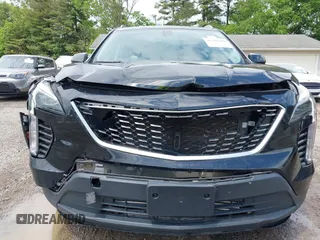 2019 Cadillac XT4 AWD Luxury z VIN 1GYFZBR41KF150209, wystawiony jako IAAI lot #42325529 z przebiegiem 76 828 mil mil oraz . Historia ofert i sprzedaży dostępna na DreamBid. Obrazek 6.