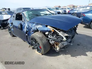 2013 Nissan 370Z z VIN JN1AZ4EH2DM380511, wystawiony jako IAAI lot #41912193 z przebiegiem Nie podano mil oraz . Historia ofert i sprzedaży dostępna na DreamBid. Obrazek 1.