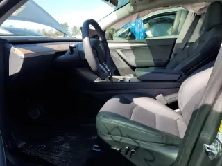 2025 Tesla Model Y Long Range with VIN 7SAYGDED0SF247561, listed as a Copart auction lot 50736875 with 9,094 mi miles and Salvage Title. Bid and sale history available at DreamBid. Image 7.