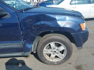 2005 Jeep Grand Cherokee Laredo with VIN 1J4HR48N45C605543, listed as a IAAI auction lot 42612473 with 158,456 mi miles and . Bid and sale history available at DreamBid. Image 12.