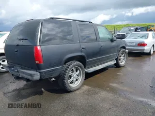 1999 Chevrolet Tahoe Z71 with VIN 1GNEK13R1XJ425996, listed as a IAAI auction lot 41798943 with 203,106 mi miles and . Bid and sale history available at DreamBid. Image 4.