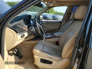 2012 BMW X5 35i with VIN 5UXZV4C57CL756062, listed as a Copart auction lot 65752145 with 160,860 mi miles and Clean title. Bid and sale history available at DreamBid. Image 7.