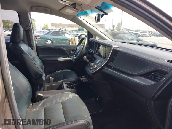 2015 Toyota Sienna SE with VIN 5TDXK3DCXFS680767, listed as a IAAI auction lot 42237107 with 105,912 mi miles and . Bid and sale history available at DreamBid. Image 5.