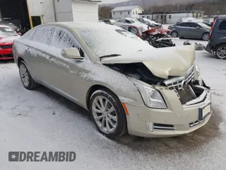 2014 Cadillac XTS Luxury with VIN 2G61M5S37E9304598, listed as a IAAI auction lot 41006051 with 115,879 mi miles. Bid and sale history available at carsss.com. Image 1.