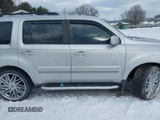 2011 Honda Pilot EX-L with VIN 5FNYF3H6XBB041672, listed as a IAAI auction lot 41337038 with 205,741 mi miles and . Bid and sale history available at DreamBid. Image 14.