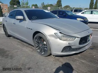 2014 Maserati Ghibli S Q4 with VIN ZAM57RTA8E1095303, listed as a IAAI auction lot 41600587 with 98,215 mi miles. Bid and sale history available at carsss.com. Image 1.