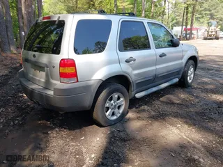 2007 Ford Escape XLT with VIN 1FMCU93167KA51832, listed as a IAAI auction lot 42115125 with 148,584 mi miles. Bid and sale history available at carsss.com. Image 4.