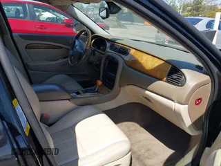 2003 Jaguar S-Type with VIN SAJEA01T13FM70486, listed as a IAAI auction lot 41989501 with 100,109 mi miles and . Bid and sale history available at DreamBid. Image 5.