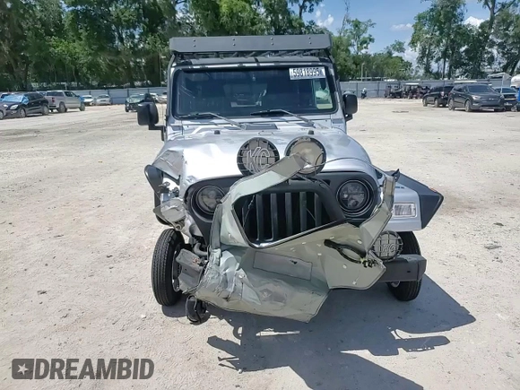 2005 Jeep Wrangler Sport z VIN 1J4FA49S75P324462, wystawiony jako Copart lot #59818995 z przebiegiem 183 558 mil mil oraz Nie do naprawy • Non repairable. Historia ofert i sprzedaży dostępna na DreamBid. Obrazek 13.