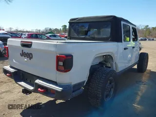 2020 Jeep Gladiator Rubicon with VIN 1C6JJTBG1LL181875, listed as a IAAI auction lot 41722037 with 51,037 mi miles and . Bid and sale history available at DreamBid. Image 4.