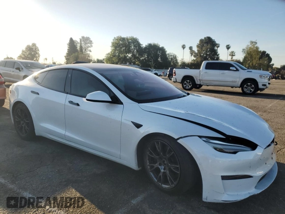 2022 Tesla Model S Plaid with VIN 5YJSA1E66NF467523, listed as a Copart auction lot 49731225 with Not Provided miles and Salvage Title. Bid and sale history available at DreamBid. Image 4.
