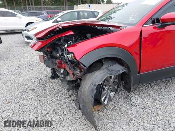 2023 Mazda CX-30 S Premium with VIN 3MVDMBDM1PM520048, listed as a IAAI auction lot 42468172 with 7,277 mi miles and . Bid and sale history available at DreamBid. Image 6.