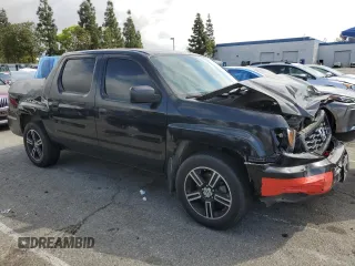 2014 Honda Ridgeline Sport with VIN 5FPYK1F7XEB008758, listed as a Copart auction lot 51022445 with 197,006 mi miles and Salvage title. Bid and sale history available at DreamBid. Image 4.
