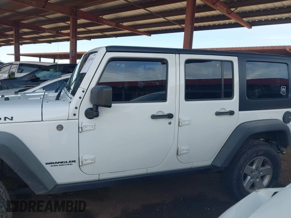 2015 Jeep Wrangler Unlimited Rubicon with VIN 1C4BJWFG9FL744927, listed as a IAAI auction lot 42169740 with 106,352 mi miles and . Bid and sale history available at DreamBid. Image 15.